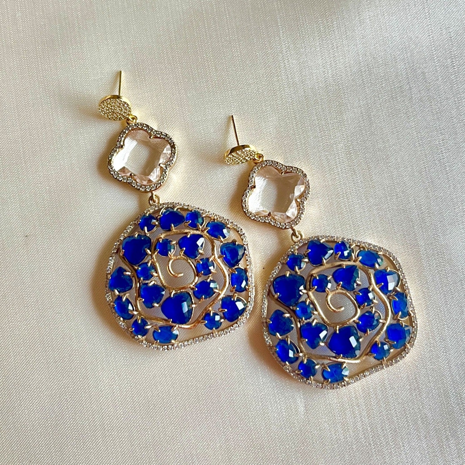Jewel Treatzz Irregular Shaped Blue Doublet Stone, Transparent Four Petal Clover Flower And CZ Stone Gold Plated Chandlelier Earrings