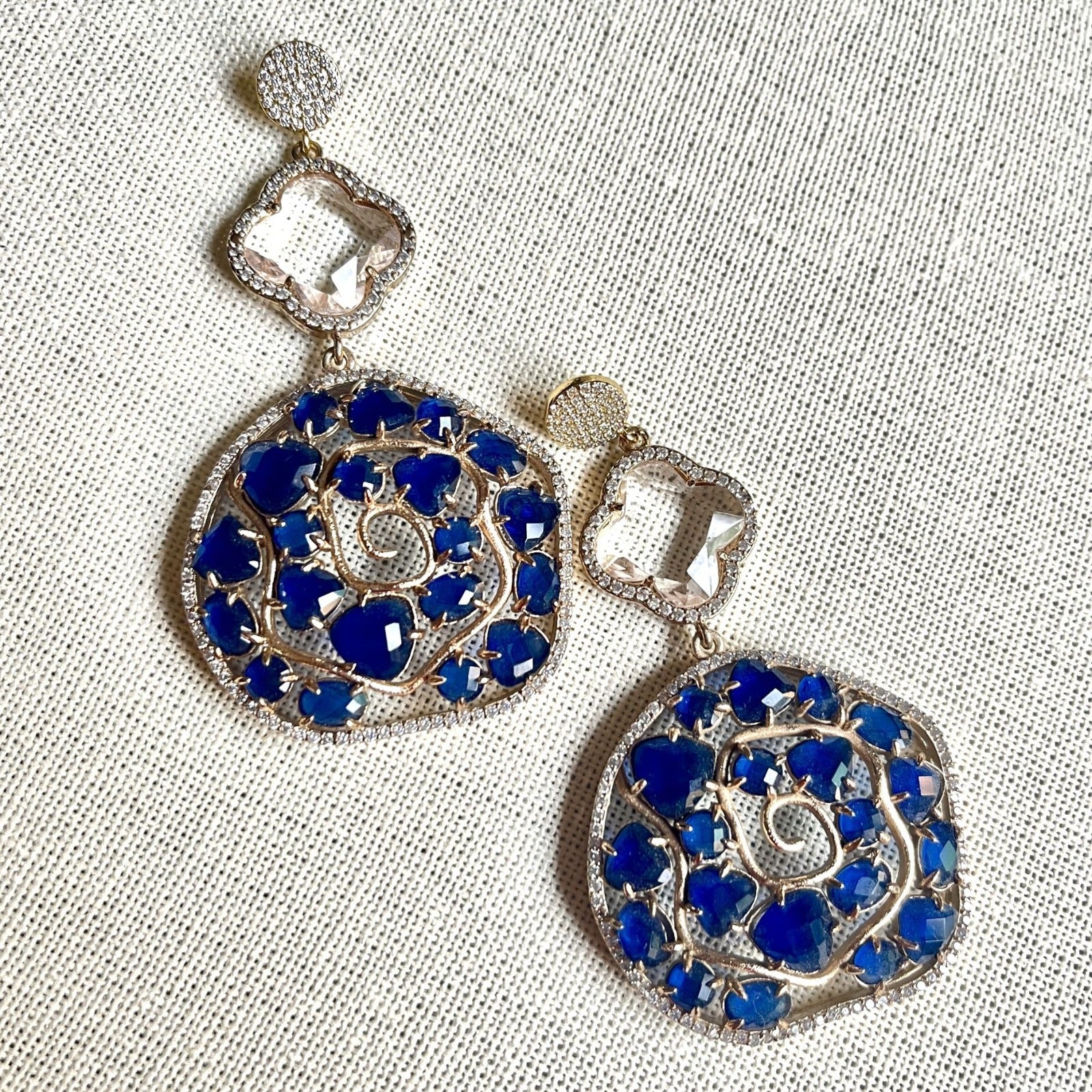 Jewel Treatzz Irregular Shaped Blue Doublet Stone, Transparent Four Petal Clover Flower And CZ Stone  Gold Plated Chandlelier Earrings
