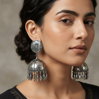 Urthn These oxidised silver jhumka earrings feature a floral stud for Women