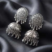 Urthn These oxidised silver jhumka earrings feature a floral stud for Women