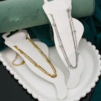 Klitz  Stylish Stainless Steel Layered Anklet / Payal (Pack of 12)
