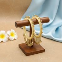 Etnico Traditional Ivory-Tone Bangles with Brass Stud Detailing and Hanging Ghungroo Charms for Women (ADB595Cr)