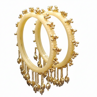 Etnico Traditional Ivory-Tone Bangles with Brass Stud Detailing and Hanging Ghungroo Charms for Women (ADB595Cr)