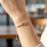 Mahi Adjustable Infinity Bracelet with Elegant White Crystal and Rose Gold Plating Bracelet for Women (BR1101101ZWhi)