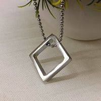 Etnico Silver?Tone Square Pendant Necklace with Minimalist Design (MJN005S)