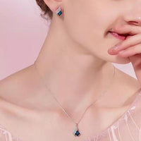 Mahi Shining Angel Wings Shaped Montana Blue and White Crystal Pendant Necklace Earrings Set for Women (NL1103810RMBlu)