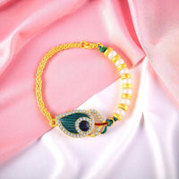 Mahi Peacock-Feather-Shaped Lumba Rakhi for Bhabhi | Artificial Pearl Beaded Bracelet with Stone-Studded & Enamel (RAL1100851G)
