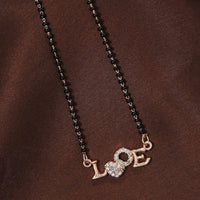 Etnico 18k Rose Gold Plated Traditional Single Line American Diamond Lovers Design Pendant with Black Beads Chain Mangalsutra for Women (D090)